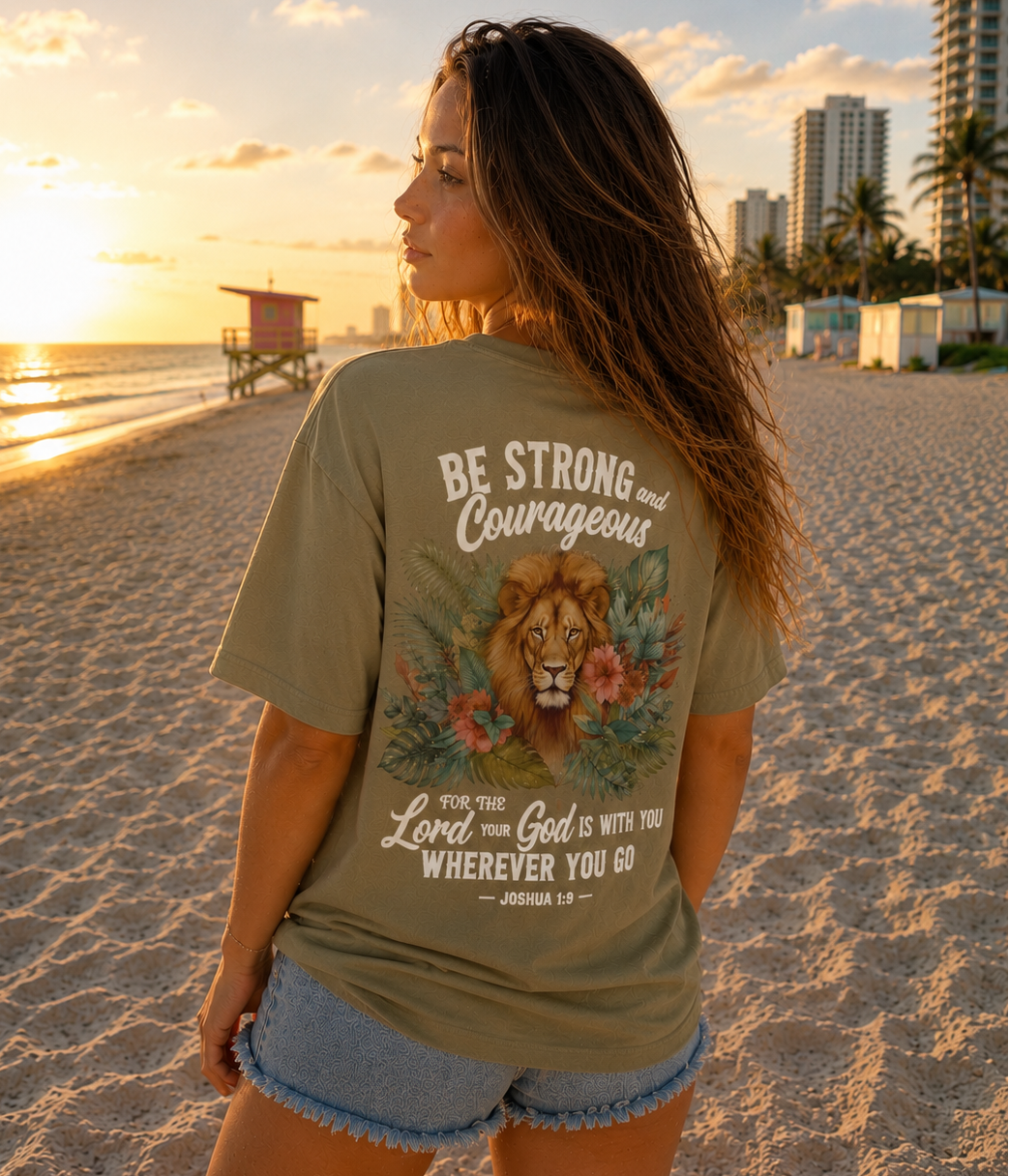 Woman on a beach wearing a t-shirt with Bible Verse