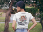 Christian T-Shirt - Be Strong and Courageous | Lion with Tropical Floral Design and Bible Verse Joshua 1:9