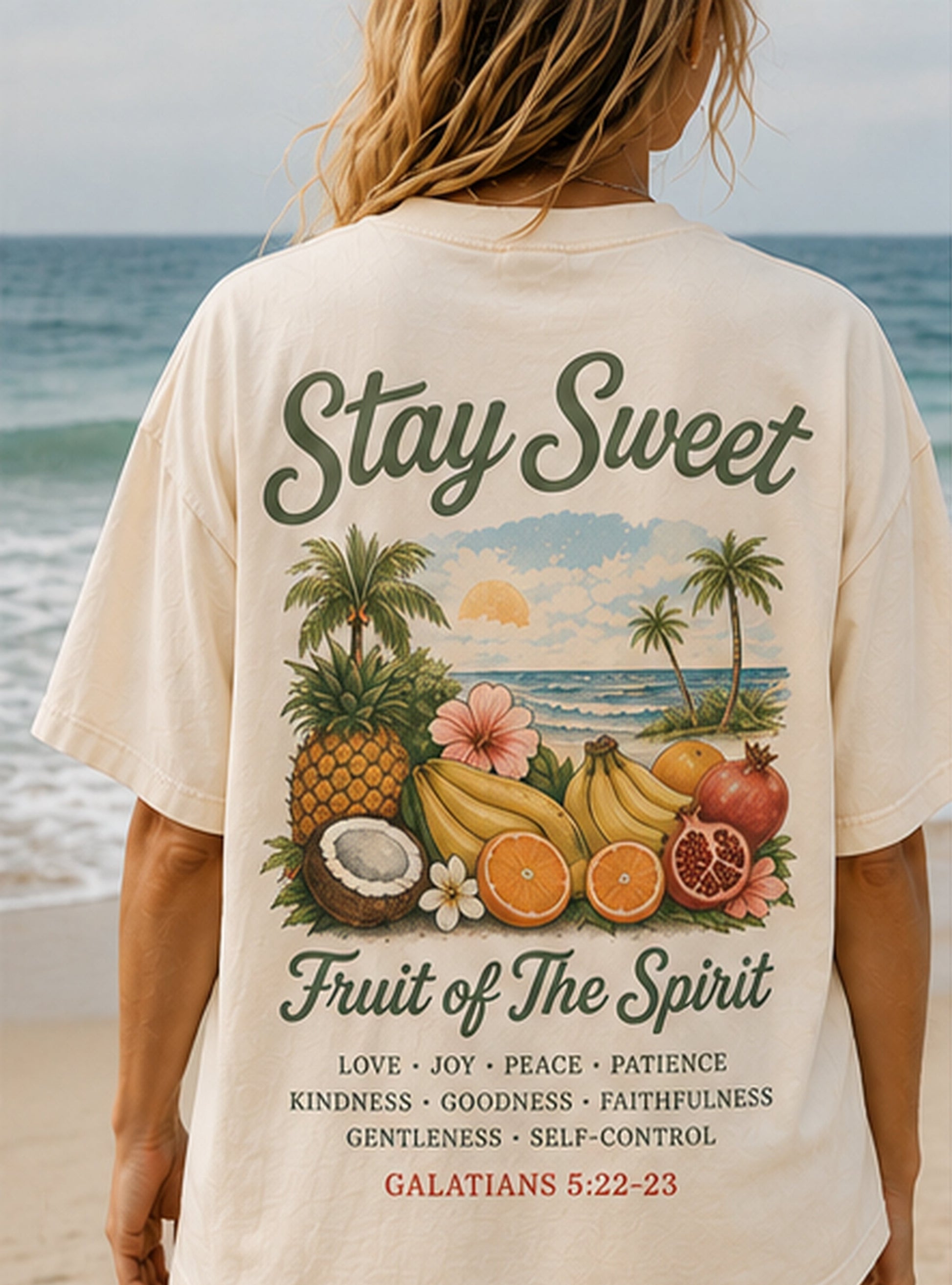 Person wearing a t-shirt with a tropical fruit design and scripture tee