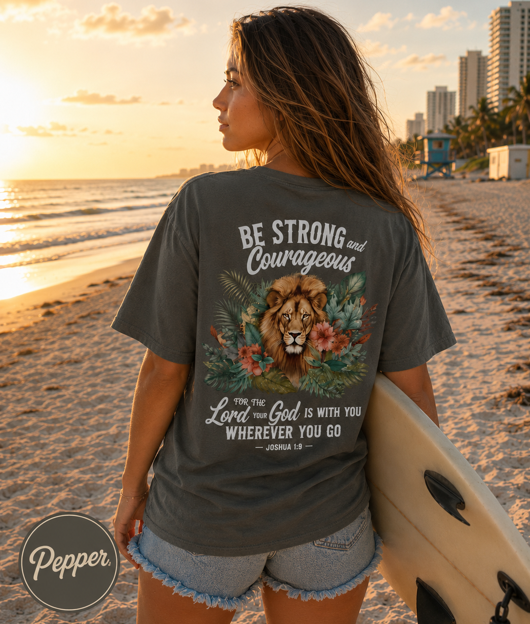 Woman on a beach holding a surfboard wearing a Christian t-shirt